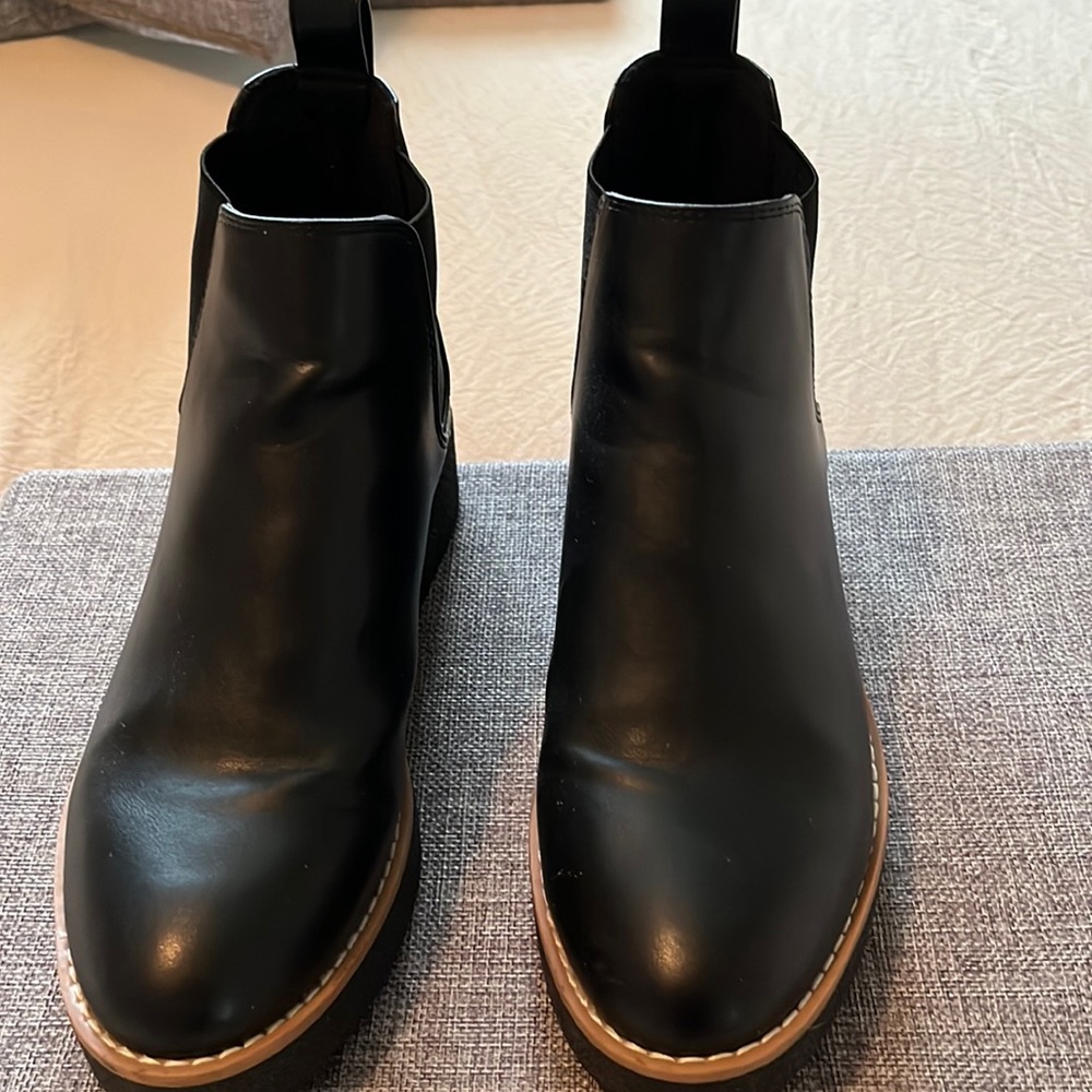 Black platform ankle boots.